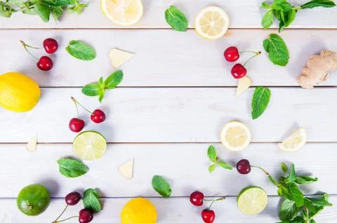 Colorful pattern of cherry, mint, lime, lemon,ginger slices. . Limes and Lemo Stock Photos