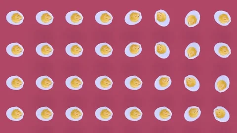 Colorful pattern of chicken eggs on pink background. Seamless pattern with egg Stock Footage 167477109