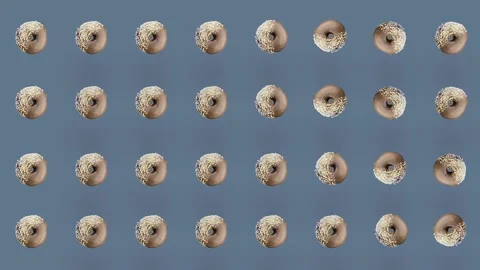 Colorful pattern of chocolate donuts isolated on grey background. Seamless Stock Footage 167486118