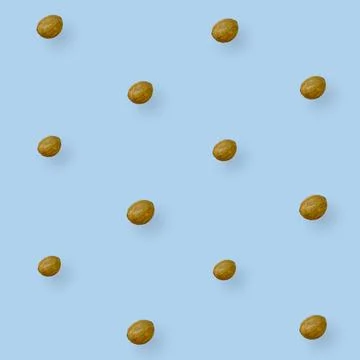 Colorful pattern of coconuts on blue background. Top view. Flat lay. Pop art Stock Photos