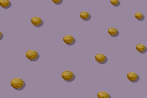 Colorful pattern of coconuts on pastel pink background with shadows. Top view Stock Photos