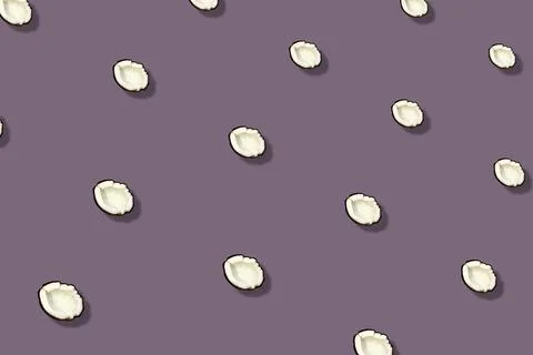 Colorful pattern of coconuts on purple background. Top view. Flat lay. Pop art Foto stock
