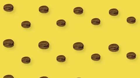 Colorful pattern of coffee beans on yellow background with shadows. Seamless Stock Footage 167478332