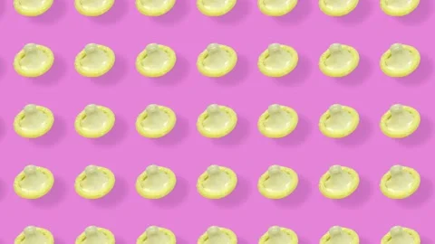 Colorful pattern of condoms on pink background with shadows. Seamless pattern Video stock 167486657
