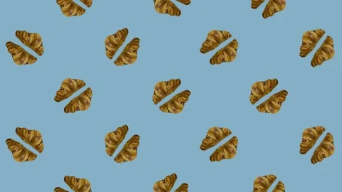 Colorful pattern of croissants on blue background. Seamless pattern with Stock Footage 167489166