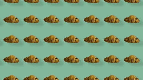 Colorful pattern of croissants on green background with shadows. Seamless Stock-Footage 167487860