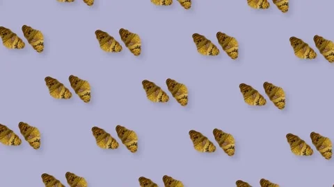 Colorful pattern of croissants on purple background. Seamless pattern with Stock Footage 167484269