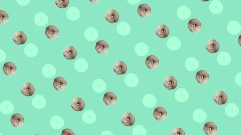 Colorful pattern of donuts isolated on green background. Seamless pattern with Stock Footage 167484775