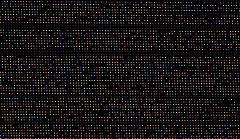A colorful pattern of dots on a black background Stock Photos