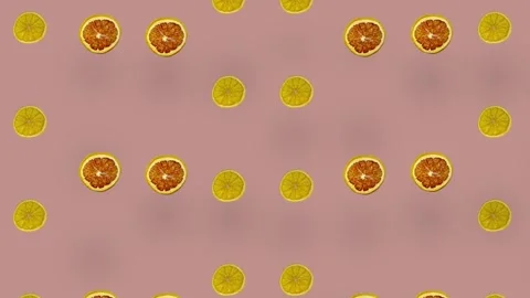 Colorful pattern of dried grapefruits and oranges slices on pink background with Stock Footage 167476008