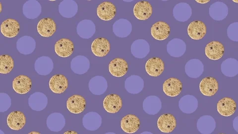 Colorful pattern of fresh chocolate chip cookies on purple background. Seamless Stock Footage 167484980