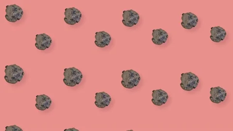 Colorful pattern of fresh chocolate chip cookies on pink background. Seamless Stock Footage 167486584