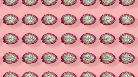 Colorful pattern of fresh dragon fruit on pink background with shadows. Seamless Stock Footage 167479664