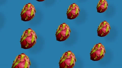 Colorful pattern of fresh dragon fruit on blue background with shadows. Seamless Stock Footage 167486806
