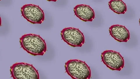 Colorful pattern of fresh dragon fruit on purple background with shadows Stock Footage 167487181