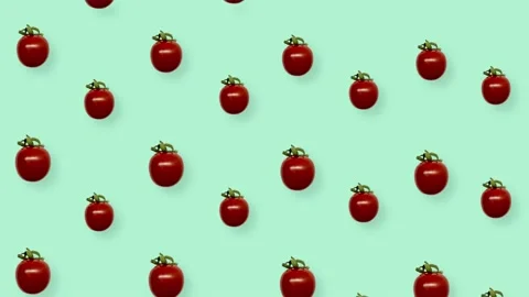 Colorful pattern of fresh red tomatoes on green background. Seamless pattern Stock Footage 167486126