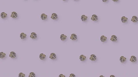 Colorful pattern of fresh rotating chocolate chip cookies on purple background Stock Footage 167475248