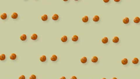 Colorful pattern of fresh rotating orange pumpkins. Top view. Seamless pattern Stock Footage 167484172