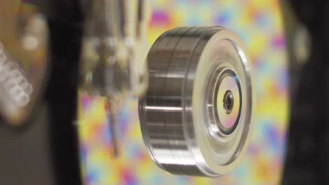 Colorful pattern on hard drive platters spinning inside disassembled computer HD Stock Footage 204944566