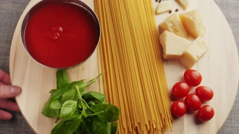 Colorful pattern of italian pasta, tomatoes, sauce, penne pasta ingredients Stock Footage 232414934