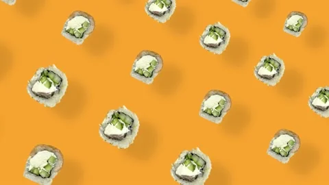 Colorful pattern of japanese sushi rolls on orange background with shadows Stock Footage 167486465
