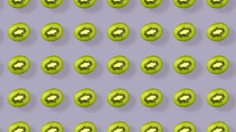 Colorful pattern of kiwi. Top view. Minimal tropical fruit concept. Seamless Stock Footage 167488024