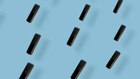 Colorful pattern of lipsticks on blue background with shadows. Seamless pattern Stock Footage 167485063