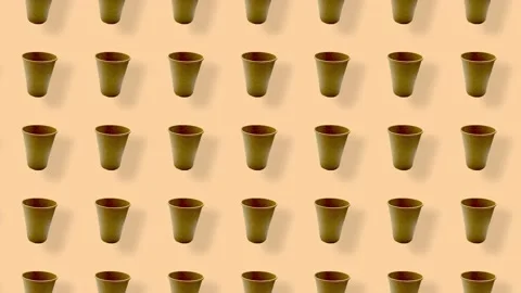 Colorful pattern of paper drinking cups on orange background with shadows Stock-Footage 167478999