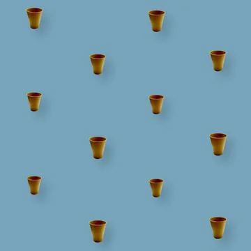 Colorful pattern of paper drinking cups on blue background. Top view. Flat lay Foto stock