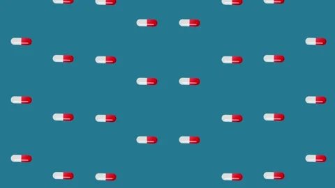 Colorful pattern of pills on blue background. Seamless pattern with capsules Stock Footage 169239983