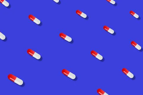 Colorful pattern of pills on blue background with shadows. Seamless pattern with 스톡 일러스트