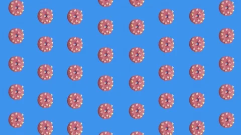 Colorful pattern of pink donuts isolated on blue background. Seamless pattern Stock Footage 167484596