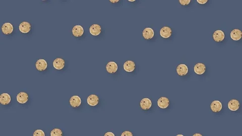 Colorful pattern of rotating fresh chocolate chip cookies on grey background Stock Footage 167484195