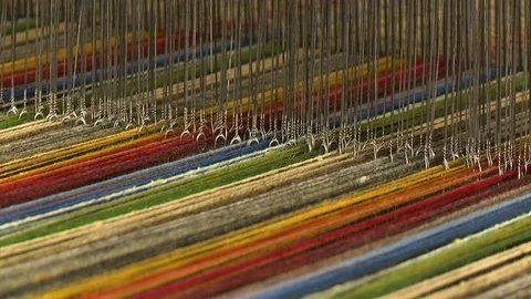 Colorful pattern of threads on a loom Stock Footage 118995495