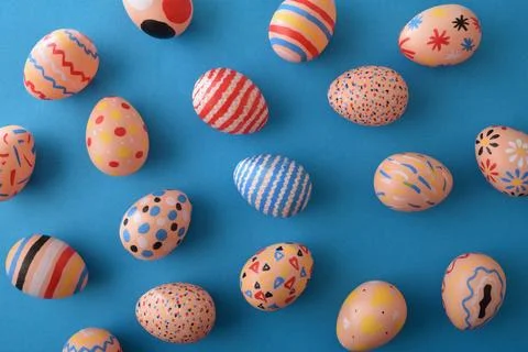 Colorful Patterned Easter Eggs on Blue Background 库存照片