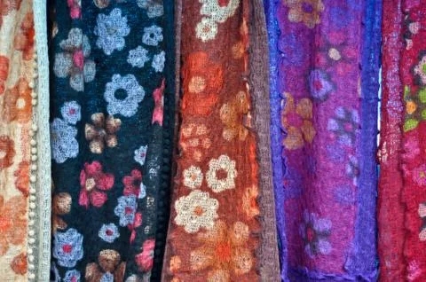 Colorful patterned fabrics hanging in a row Stock Photos