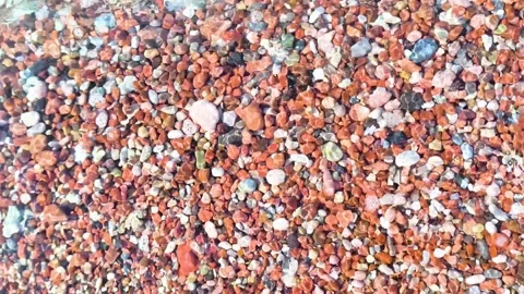 Colorful pebble beach texture close up background Stock Footage 340533293