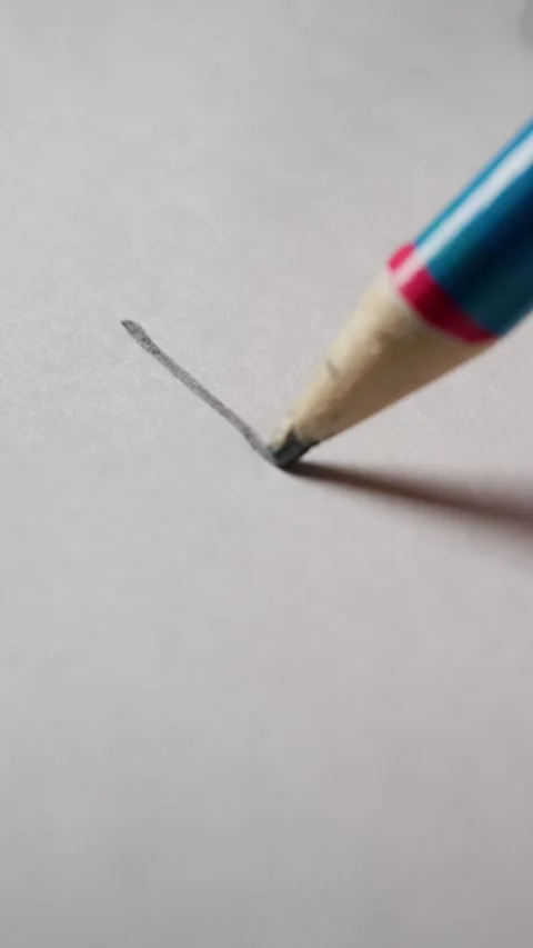 Colorful Pencil Graphite Tip Pressing on Textured White Paper Stock Footage 339366029