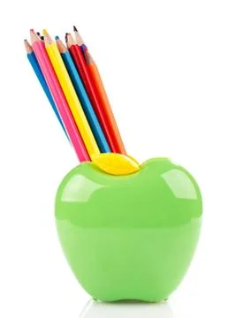 Colorful pencils in apple shaped stand Stock Photos