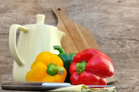 Colorful peppers on a rustic background Stock Photos