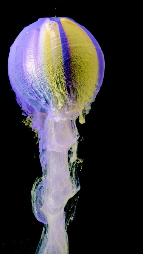 Colorful pigment sphere sinking into liquid with trailing translucent plumes and Stock Footage 340780935