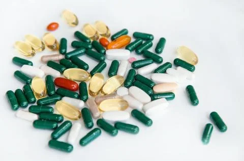 Colorful pills and vitamins on a white background. Medical pill. multi-colored Stock Photos