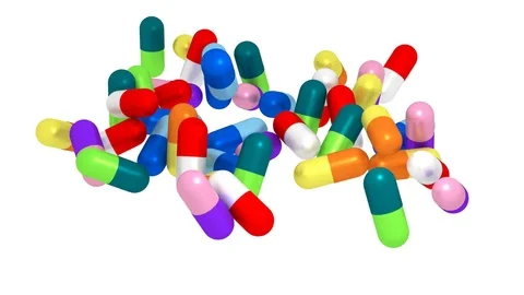 Colorful pills fall down on white background Stock Footage 83641928