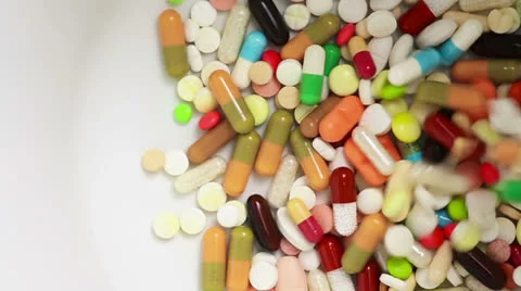 Colorful pills falling down Video stock 23132452