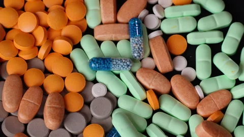 Colorful Pills Rotating Texture Macro Top Wiew Stock Footage 331088915
