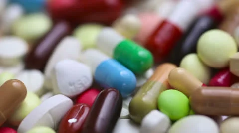 Colorful pills turning in seamless loop Stock Footage 23308448