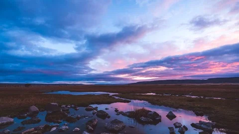 Colorful pink sunset with reflection over wetlands Stock Footage 100491358