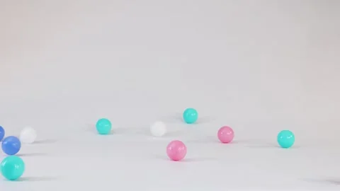Colorful Plastic Balls Falling and Bouncing on a White Background 스톡 동영상 328065442
