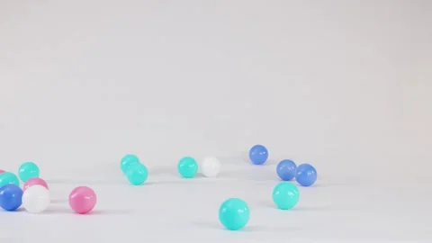 Colorful Plastic Balls Falling and Bouncing on a White Surface 스톡 동영상 328147403