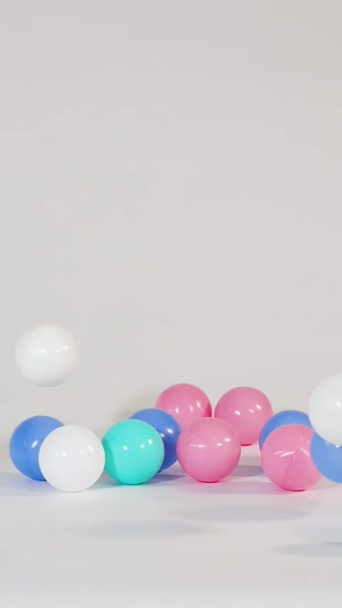 Colorful Plastic Balls Falling and Bouncing on a White Surface 스톡 동영상 328266887